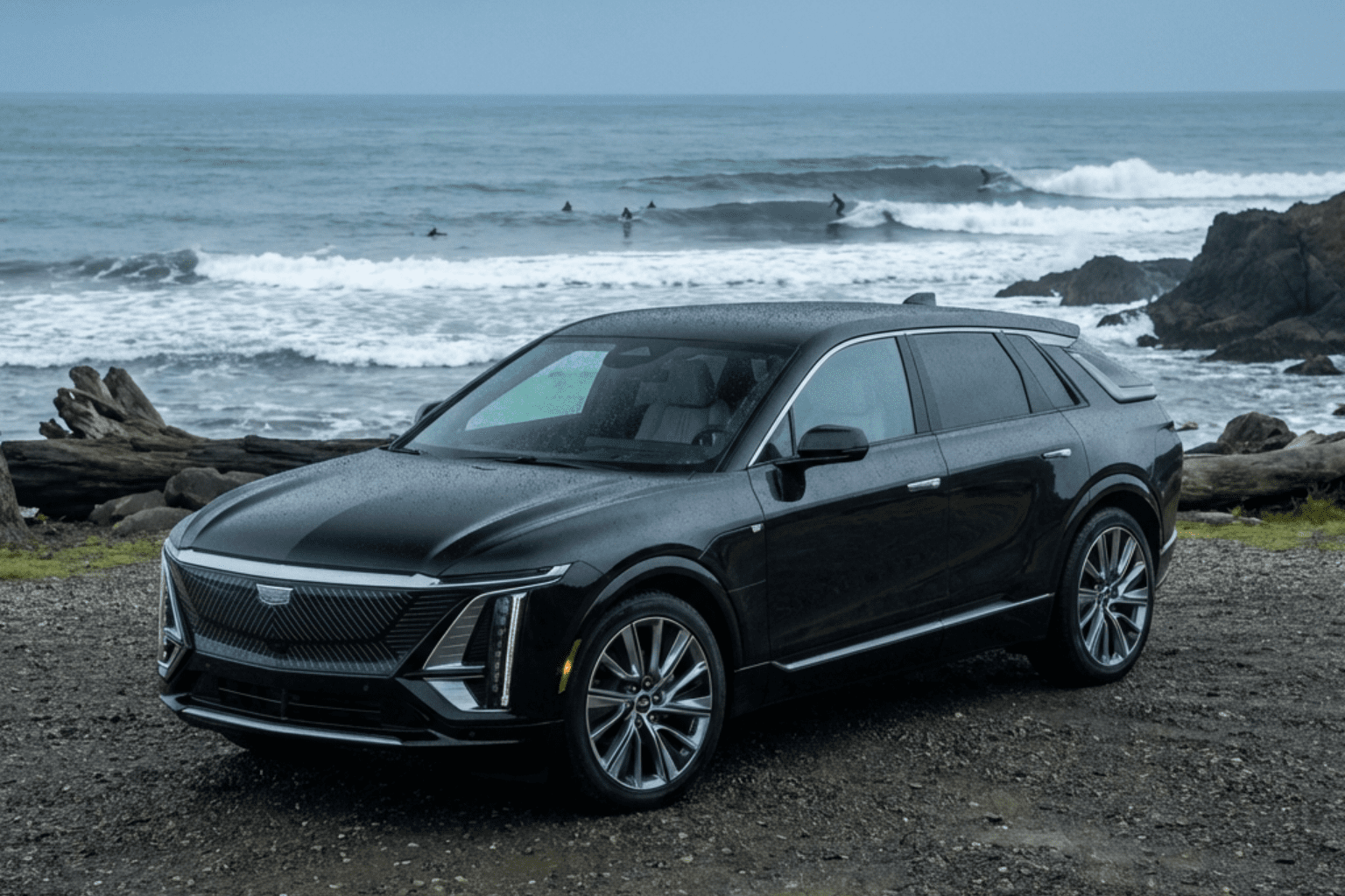 Vancouver Island surfing beach with modern electric luxury travel vehicle